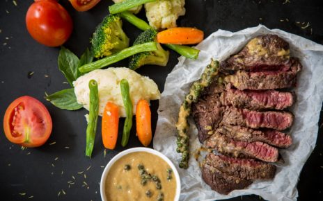 slices of steak with side dish